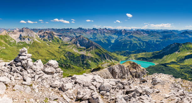 View to the Alps in Austria Awesome view from the mountain Spuller Schafberg to the Lechquellen mountains and the lake Spullersee at the Lech valley in Vorarlberg, Austria. Extremely high resolution. lechtal alps stock pictures, royalty-free photos & images