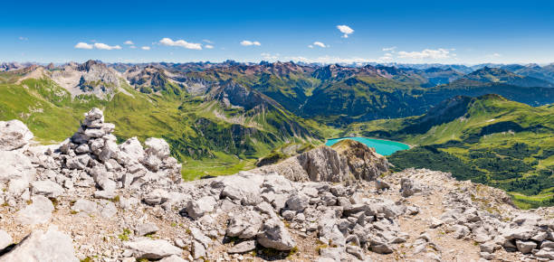 View to the Alps in Austria Awesome view from the mountain Spuller Schafberg to the Lechquellen mountains and the lake Spullersee at the Lech valley in Vorarlberg, Austria. Extremely high resolution. lechtal alps stock pictures, royalty-free photos & images