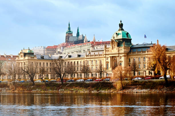 View to the Prague Government Office and Prague Castle from the Vltava river. Famous place in the Czech Republic, ancient Hradcany hill with the president office and Straka academie View to the Prague Government Office and Prague Castle from the Vltava river. Famous place in the Czech Republic, ancient Hradcany hill with the president office and Straka academie hradcany castle stock pictures, royalty-free photos & images