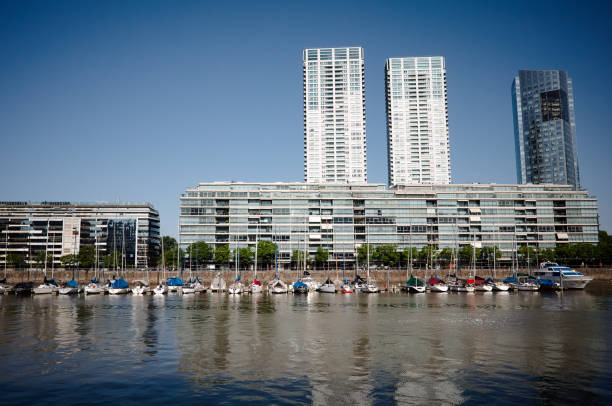 View to the real estate and skyscrapers of Puerto Madero district. Sailing yachts moored in Puerto Madero district in Buenos Aires. stock photo