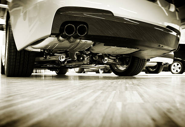 view under the car view under the car, toned image exhaust pipe stock pictures, royalty-free photos & images