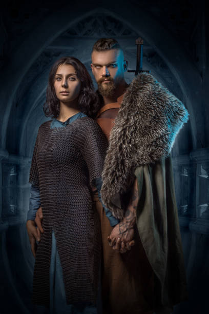 Viking couple in studio shot stock photo