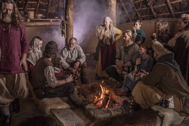A viking family in a viking village settlement An viking family posing for a group pic in an authentic viking settlement village setting historical reenactment stock pictures, royalty-free photos & images