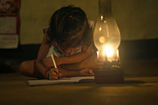 Village Girl reading book in lighting lamp
