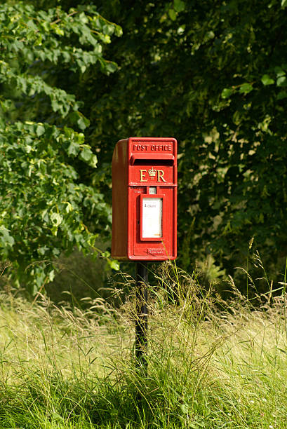 Village Post Box A village post box in Wotton Underwood letterbox flowers uk stock pictures, royalty-free photos & images