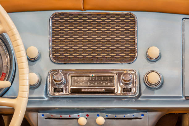 Vintage car radio with speaker inside a classic American car stock photo
