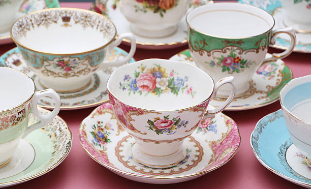Vintage China Vintage china tea cups on a dusty pink background porcelain stock pictures, royalty-free photos & images