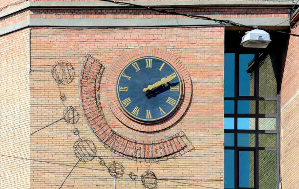 Vintage clock on the wall of old building in Kyiv Ukraine stock photo