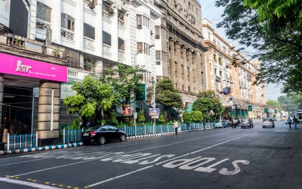 Vintage colonial buildings at the famous Park Street Kolkata with early morning city traffic KOLKATA, INDIA - March 18, 2018: Vintage colonial buildings at the famous Park Street Kolkata with early morning city traffic kolkata stock pictures, royalty-free photos & images