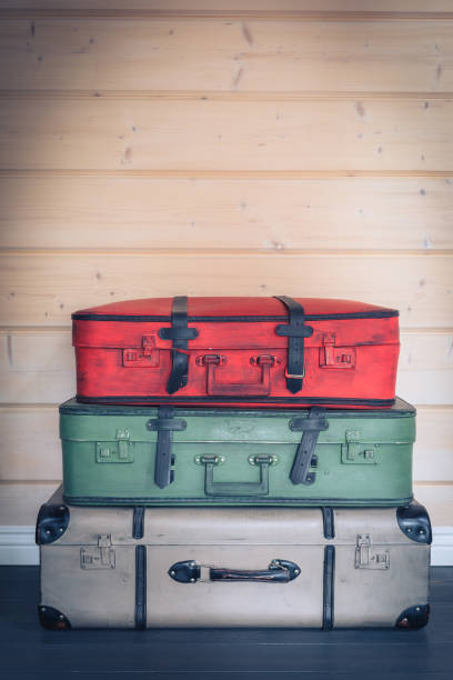 Vintage colourful pile of suitcases, travel luggage concept Vintage colourful pile of suitcases, travel luggage concept, toned broken suitcase stock pictures, royalty-free photos & images