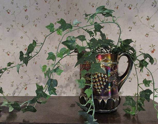 Vintage Iridescent Carnival Glass Pitcher with Vine stock photo