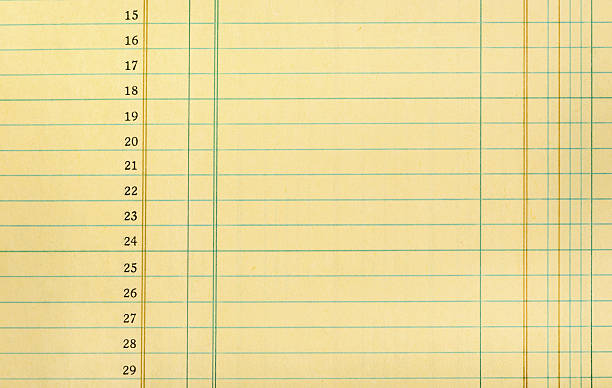 Vintage Ledger Paper Closeup of yellow numbered ledger paper accounting ledger stock pictures, royalty-free photos & images