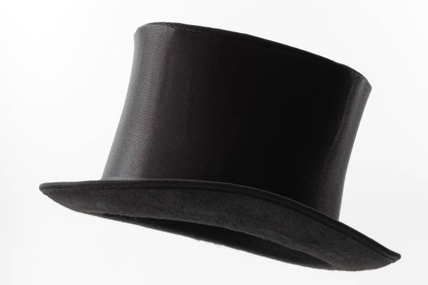 Vintage men fashion and magic show conceptual idea with side profile angle on victorian black top hat with clipping path cutout in ghost mannequin technique isolated on white background stock photo