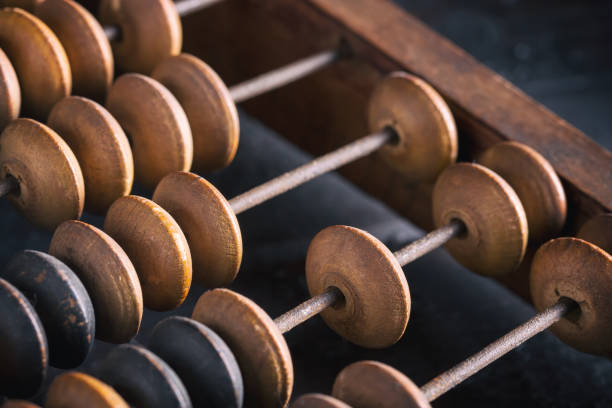 Vintage old accounting wooden abacus. Close up. Toned image Vintage old accounting wooden abacus. Close up. Toned image. abacus stock pictures, royalty-free photos & images