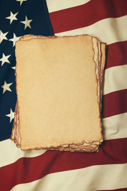 Vintage paper on old US American flag stock photo