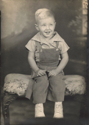 Studio vintage, antique portrait of a two-year-old boy. Photo taken in 1944.