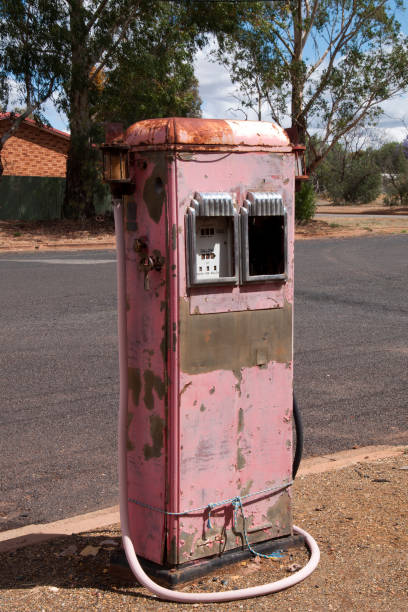 Vintage pink petrol pump in street of country town Street scene from around Cobar, Australia fuel bowser stock pictures, royalty-free photos & images