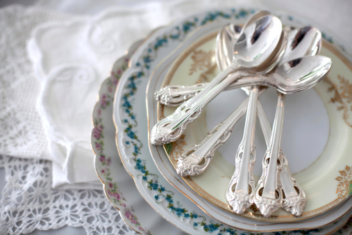 Vintage plates with silver teaspoons