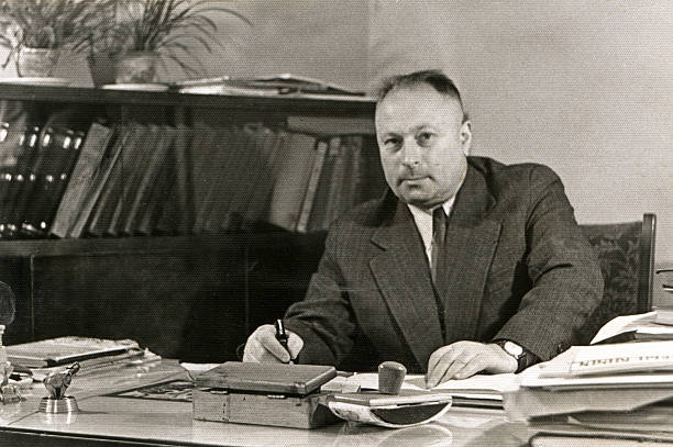 Vintage portrait of man in his office stock photo
