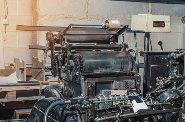 Vintage printing machine for carving in printing. Part of the old mechanism, regulators, gears. Vintage printing machine for carving in printing. Part of old mechanism, regulators, gears. linotype stock pictures, royalty-free photos & images