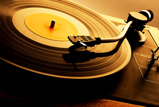 A vintage record spinning on a turntable stock photo
