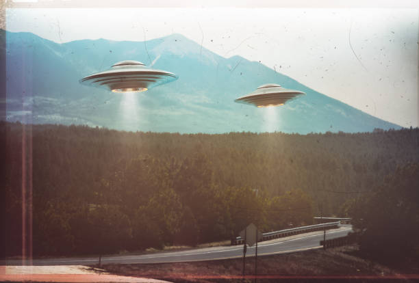 UFO Vintage Retro Antique Unidentified flying object. Two UFOs flying over a road among the trees. 3D illustration retro photo vintage. Noise and defects of old photo film. ufo stock pictures, royalty-free photos & images