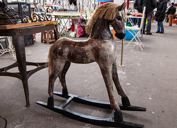 Vintage rocking horse at flea market in Paris. stock photo