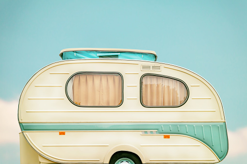 Vintage side of a caravan in two tone green and white