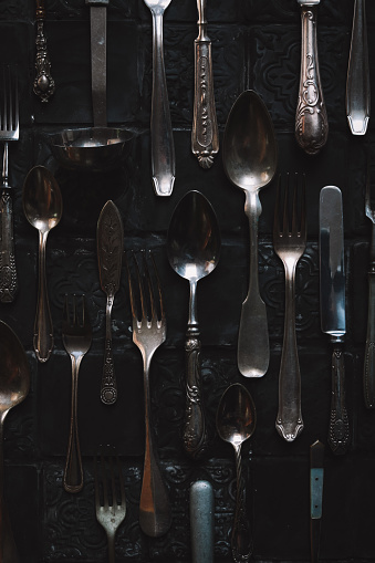 Vintage Silverware selection of cutlery on dark background flatlay