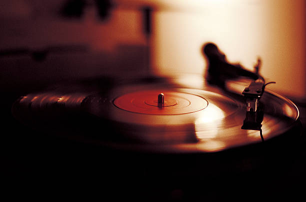 Vinyl Playing on Record Player  turntable stock pictures, royalty-free photos & images