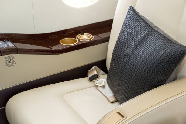Vip business jet first class seat Comfortible chairs in a modern business jet airplane. airplane seat stock pictures, royalty-free photos & images