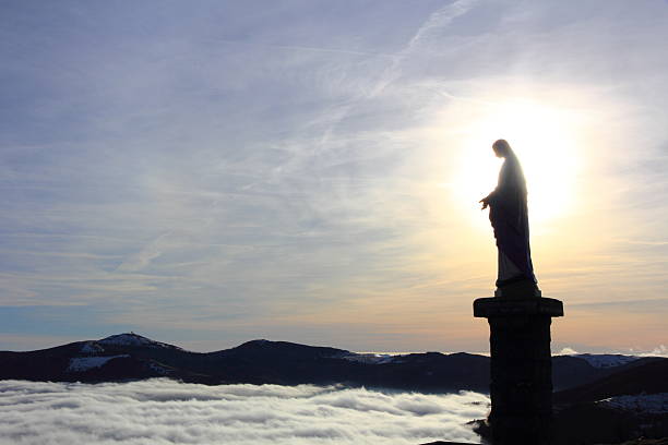 Virgin of the Small Balloon in Alsace Statue of the Virgin above the fog in Alsace munster france stock pictures, royalty-free photos & images