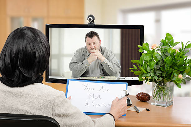 Virtual psychotherapist helps depressed man stock photo