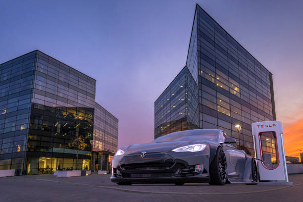 Vision of tuned, sporty Tesla S at the charging point Vision of tuned, sporty Tesla S at the charging point tesla motors stock pictures, royalty-free photos & images