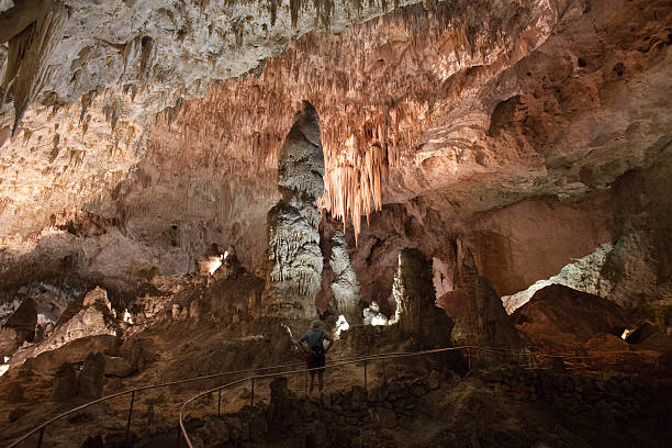 Visitor hikes Carlsbad Caverns Big Room Giant Chandelier New Mexico stock photo
