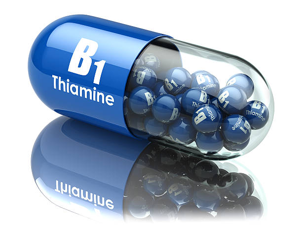 Vitamin B1 capsule. Pill with thiamine. Dietary supplements. stock photo