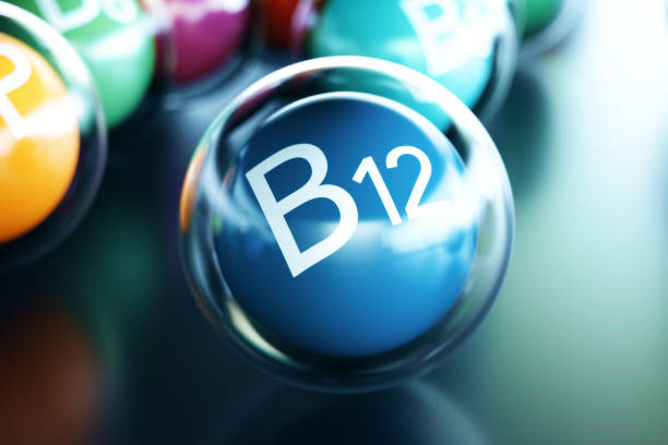Vitamin B12, on black background. Symbol of health and longevity. 3d rendering stock photo
