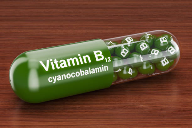 Vitamin capsule B12 on the wooden table. 3D rendering stock photo