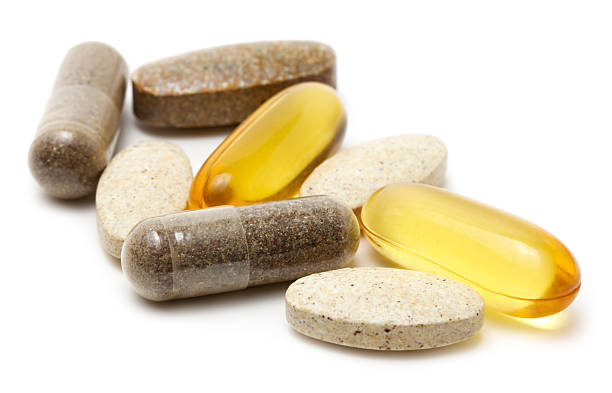vitamin supplements - vitamine stockfoto's en -beelden