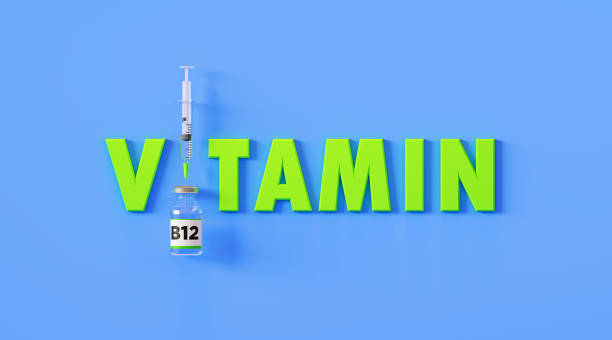 Vitamin Written Next to Syringe and Vitamin B12 Bottle on Blue Background Vitamin written next to syringe and vitamin B12 bottle on blue background, Horizontal composition with copy space. Injectable vitamin B12 concept. medical injection stock pictures, royalty-free photos & images