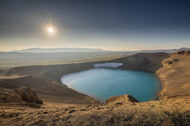 Viti crater in Krafla area of Iceland viewed from one of the outlook posts, on a nice summer evening, with sun slowly setting down. stock photo