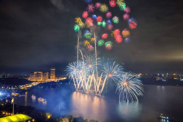 Vivid multicolored fireworks on the lake in Moscow at night stock photo