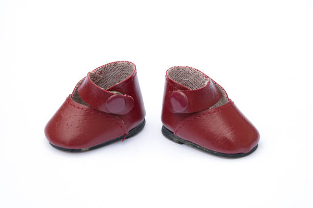 Vntage Baby Dolls Red Leather Shoes stock photo