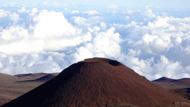 Volcanic crater at Mauna Kea Volcanic crater on the way up to Mauna Kea mauna kea stock pictures, royalty-free photos & images