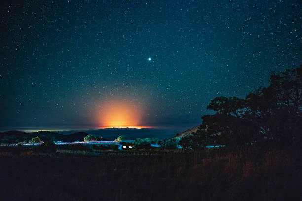 Volcanic Eruption Under a Starry Sky The glow of Kilauea's eruption lighting up the night sky as seen from Mauna Kea mauna kea stock pictures, royalty-free photos & images