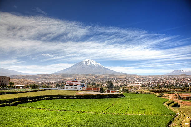 Volcano El Misti rising behind agricultural fields of Arequipa stock photo