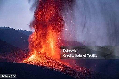 istock Volcano eruption in evening in mountains 1343781477