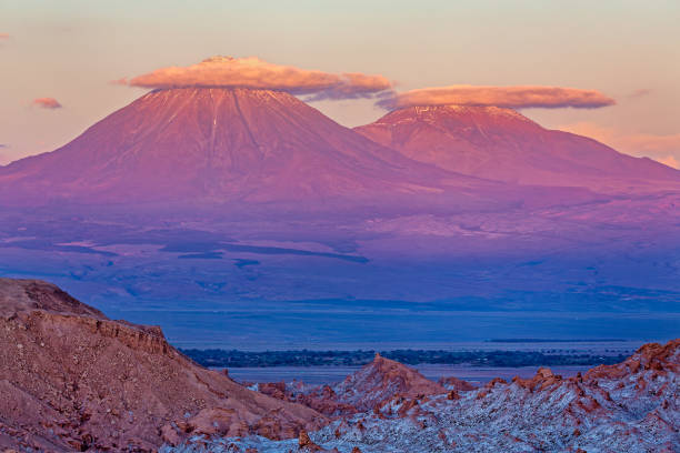 Volcanos Licancabur and Juriques at sunset - Atacama desert near San Pedro (chile) stock photo