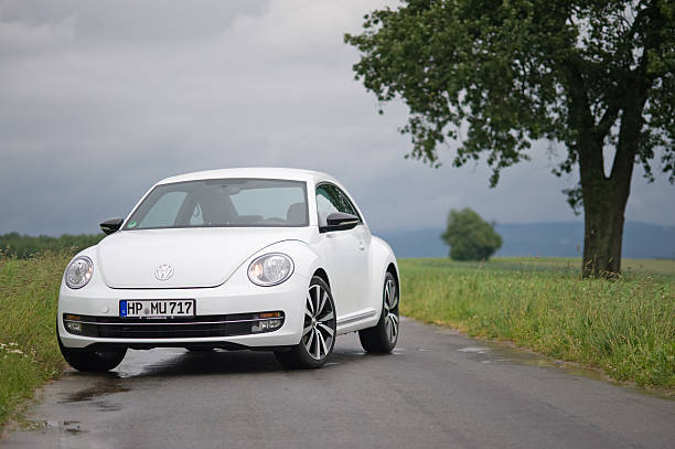 Volkswagen Beetle on a countryroad stock photo