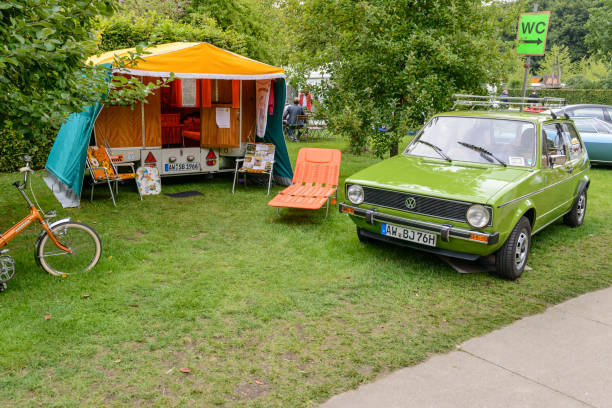volkswagen golf mark i hatchback car with a caravan - golf imagens e fotografias de stock